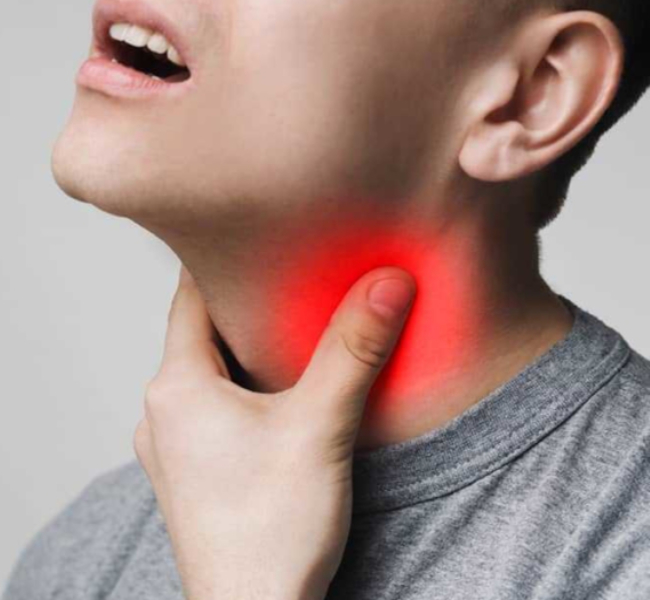 Doctor Branko Glušac showing sore and painful throat